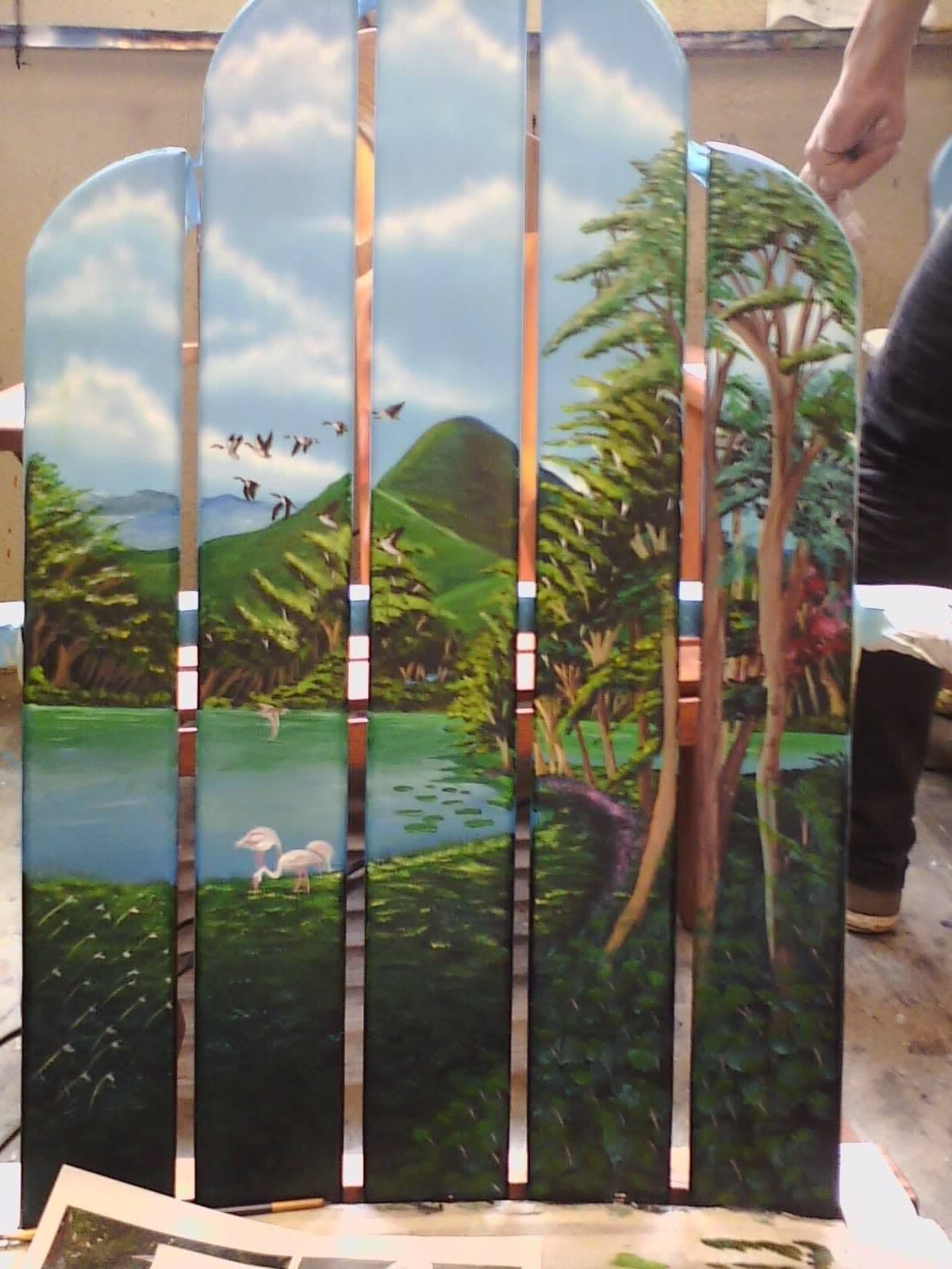 A landscape painted across vertical wooden pieces.