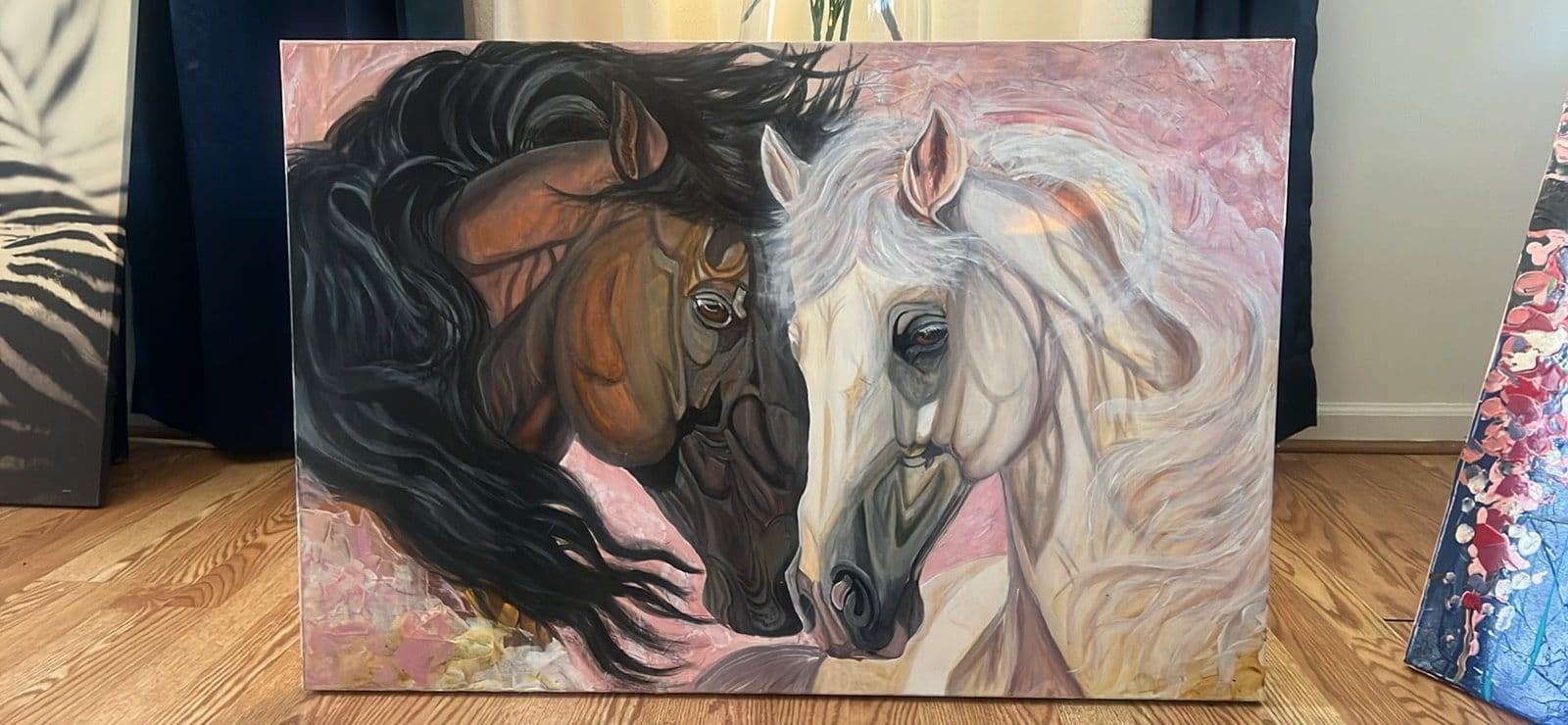 A painting of two horses, one dark and one pale, resting against each other.