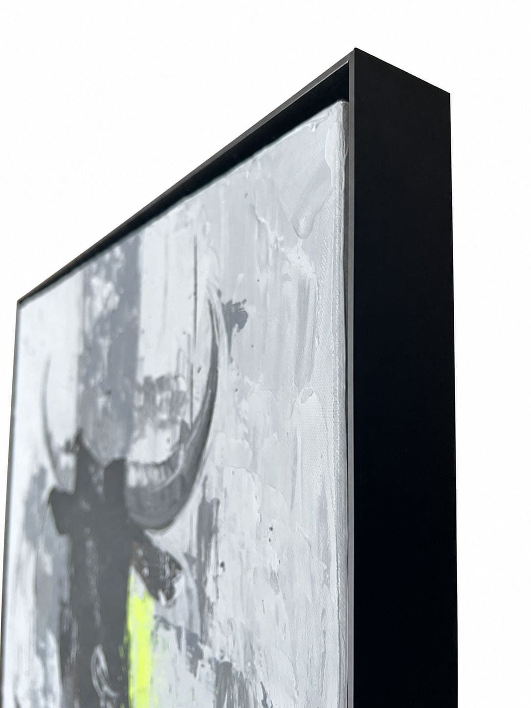 The depth of the frame seen from the side, the painted canvas edge running along it