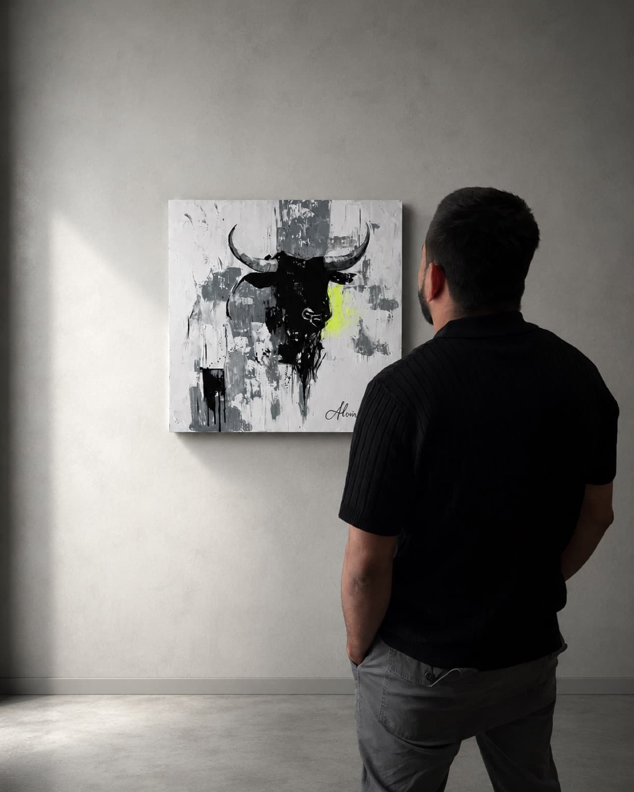 A man standing in front of the painting on a gallery wall, hands behind his back