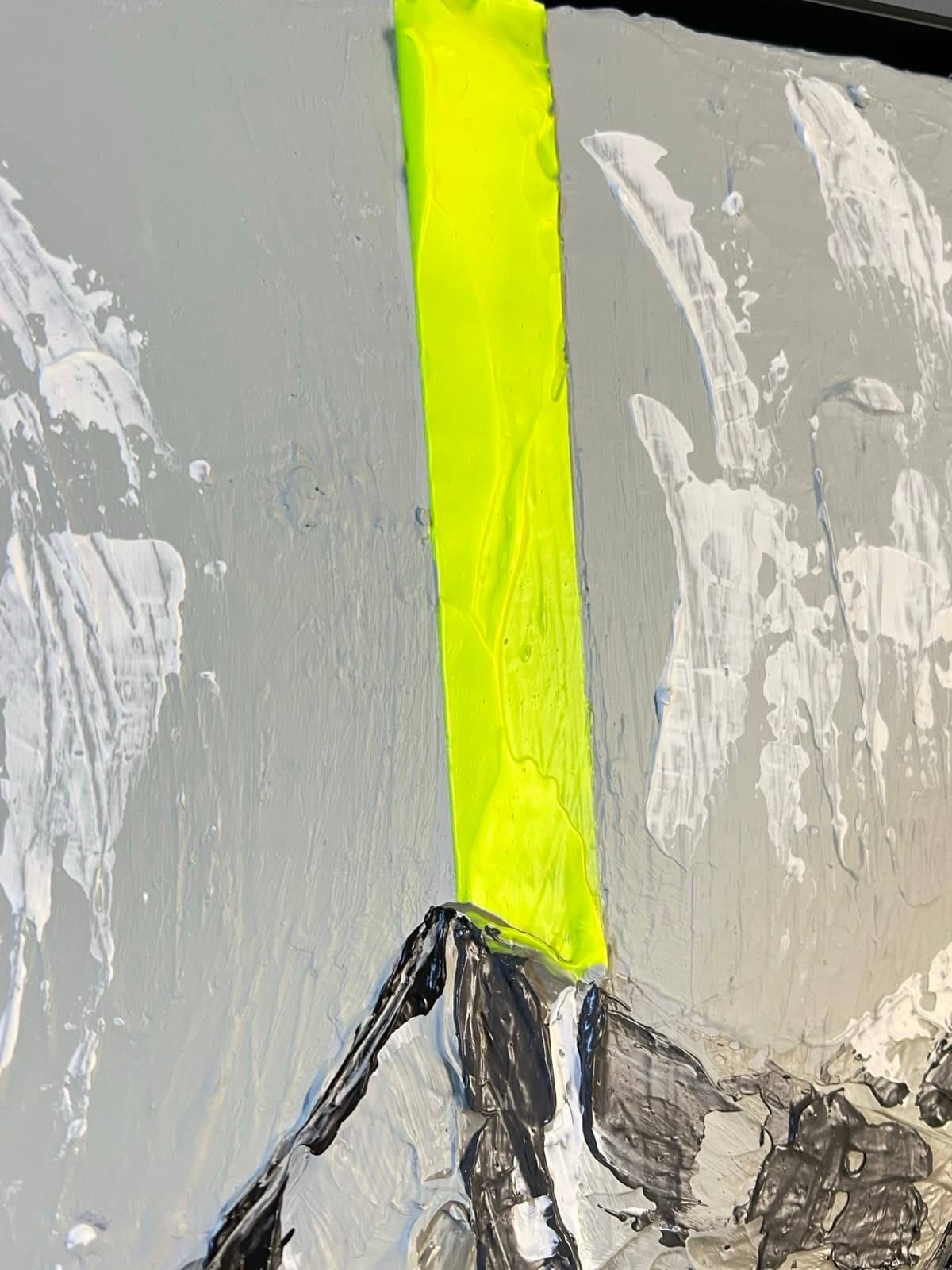 The fluorescent yellow beam falling down the mountain, laid on thick and glossy